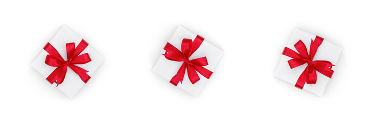 Gift boxes for Merry Christmas and holiday with red bows isolated on white background. Happy New Year and Xmas, top view