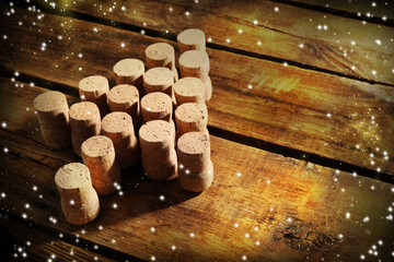 Christmas tree made of wine corks on white table. Space for text