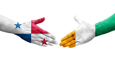 Handshake between Ivory Coast and Panama flags painted on hands, isolated transparent image.