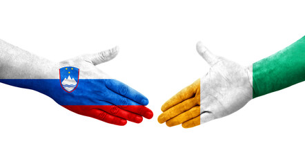 Handshake between Ivory Coast and Slovenia flags painted on hands, isolated transparent image.