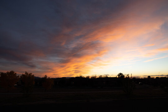 Sunset Bouncing Off Of Flowing Clouds