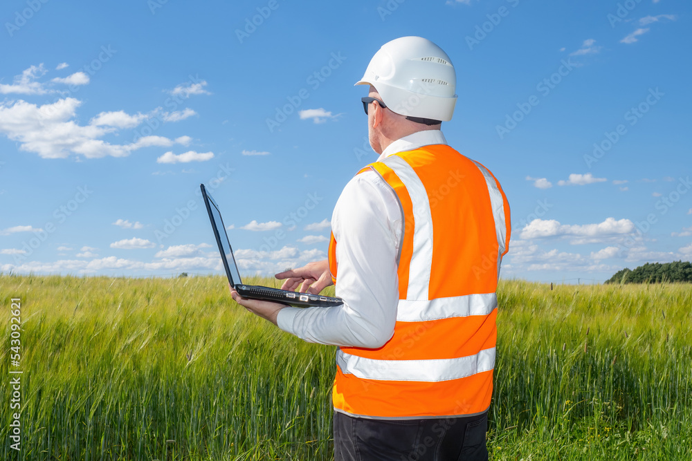 Poster man architect with back to camera. representatives architectural companies. architect with laptop st