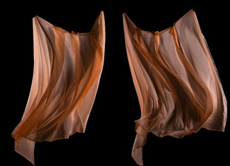 Set with beautiful delicate orange silk like floating in air. Smooth elegant pink transparent cloth fluttering throwing and wave drapes over black background isolated. Texture of flying fabric.