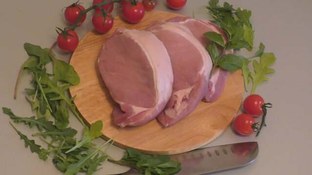 Layers of meat sliced from pork tenderloin for cooking escalope