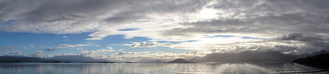 Fototapeta na wymiar Panorama of the Beagle Channel, outside of Ushuaia, Argentina, under a cloudy, afternoon sky