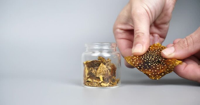 microdosing psychedelic mushroom, hand crush dried fly agaric High quality 4k footage dried fly agaric 