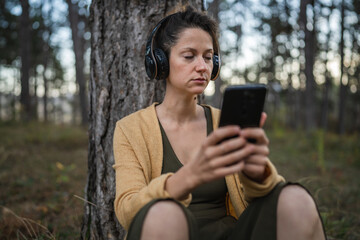 one woman in park or forest online guided meditation self-care concept