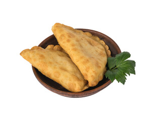 Two fried chebureks in a clay cup isolated on a white background.