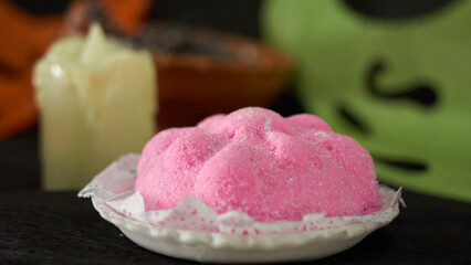 pink sweet bread called (Pan de Muerto) enjoyed during Day of the Dead
