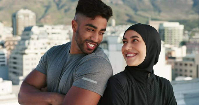 Fitness, muslim couple and exercise on city building rooftop for workout, training and motivation for healthy lifestyle. Islamic man and woman with hijab outdoor for personal trainer session