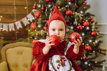 Little girl in a beautiful dress. New Year.