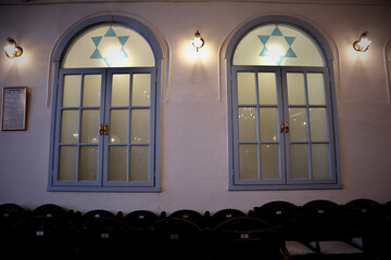 The window front of a small synagogue in Izmir (Turkey) with simple and very old decorations, like...