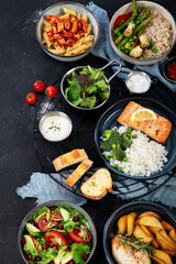 Table of various healthy food dishes. Healthy food assortment. Dieting concept.