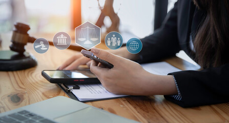 Concepts of Law and Legal services. Lawyer working with law interface icons. Blurred background.	