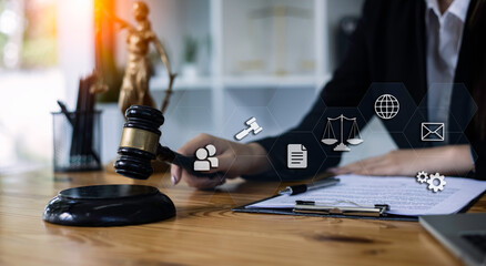 Concepts of Law and Legal services. Lawyer working with law interface icons. Blurred background.	
