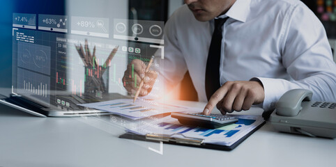 Technology and financial advisory services concert. Business man working on digital laptop computer with advisor showing plan of investment to clients at table office. Digital marketing.