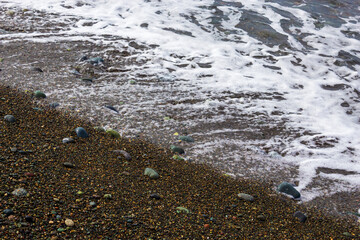 Sea shore. Beach. Pebble. Wave. Surf