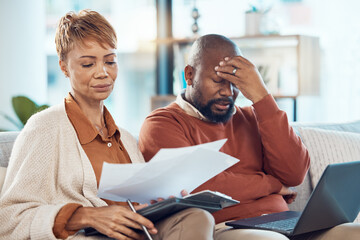 Black couple, stress and laptop in finance debt, expenses or mortgage bills together on the living...