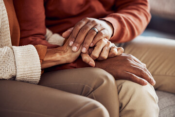 Mature couple, bonding and holding hands in support, trust or security in house, home or marriage...