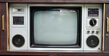 Vintage tv set. Vintage old fashioned TV isolated in home. Classic retro style old television with wooden door type.