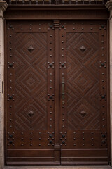Fototapeta premium Germany - December 20,2021: Old Decorative Main Entrance Wooden Door.