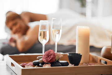 Champagne, spa massage and couple relax in zen, health and wellness salon, romance and body pamper...
