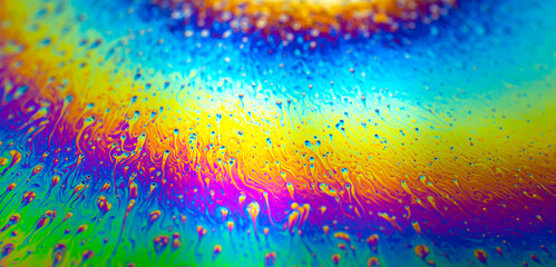 Photo of iridescent surface of soapy water. Space, halographic, psychedelic background for...