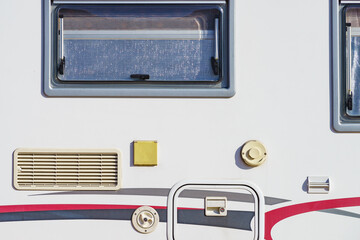 Details of camper, window with cover blind