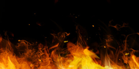 Fire and fire particles over black background