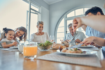 Eating food together, lunch and happy family bonding, having fun and enjoy quality time in home dining room. Love, happiness and big family of hungry grandparents, parents and child eat brunch buffet
