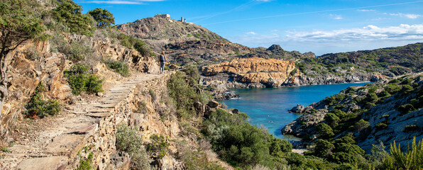 Woman tourist hiking on Cap de Creus, Costa brava in Spain - obrazy, fototapety, plakaty