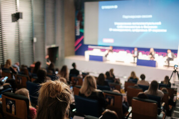 Crowd during business seminar in auditorium