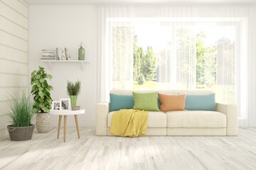Fototapeta premium Minimalist living room in white color with sofa and summer landscape in window. Scandinavian interior design. 3D illustration