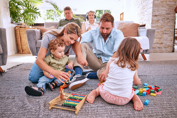 Family, toys and kids play in living room home, having fun and bonding with parents. Love, child...