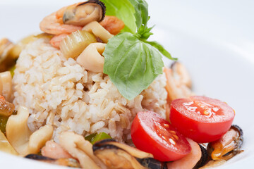 seafood rice on the white plate