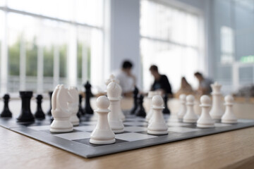 New chess board with chess pieces on table for game