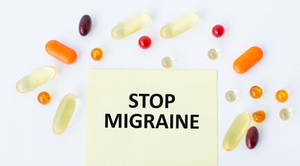 Doctor holding a card with Stop Migraine, medical concept