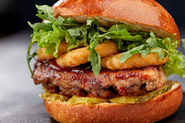 tasty burger with beef cutlet and vegetables