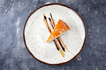 tasty cheesecake with chocolate sauce
