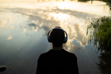 Listening to music in nature with headphones audiobook for free, balance and harmony, looking at...