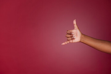 Shaka, sign and hand of a happy person with emoji for surfing, cool and relax against a purple mockup studio background. Marketing, advertise and hands for call me and happiness with mock up space