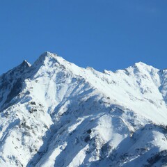 Naklejka premium Snow covered mountain peak