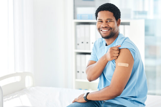 Black man, band aid and covid vaccine success in hospital in global virus safety, security or life insurance wellness. Portrait, happy smile and covid 19 injection patient with healthcare arm plaster