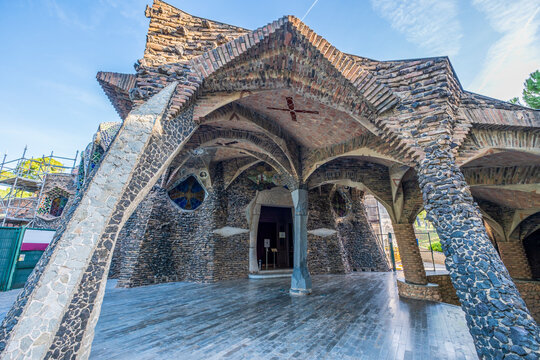 Santa Coloma de Cervello, Spain - November 2, 2022: LA COLONIA GUELL: Exterior of Church, Cripta of Colonia Guell, modernist religious building designed by Antoni Gaudi, Catalonia, Spain.