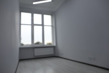 Fototapeta na wymiar Blurred view of window in empty renovated room
