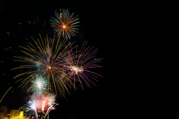 Colorful fireworks over the city at night - great for wallpapers