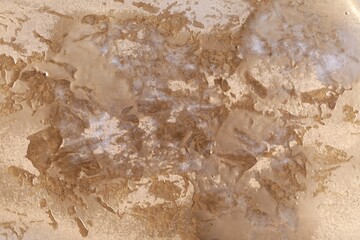 Texture of golden spray paint as background, closeup