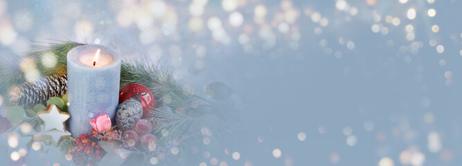 Christmas background banner with advent candle, cookies and nature decoration in snow - panorama, header with copy space - seasonal greeting card design