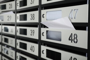 New mailboxes with keyholes, numbers and receipts, closeup