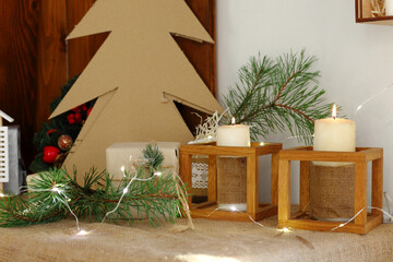 Golden Christmas candles burning, festive atmospheric lights composition.
